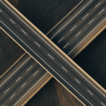An overhead image of two highway lanes crossing over each other.